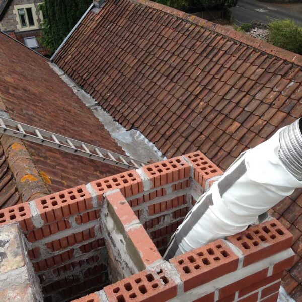 Chimney stack repaired, flue liner installed.