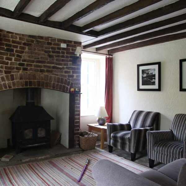 Lounge after moving in, prior to restoration works.