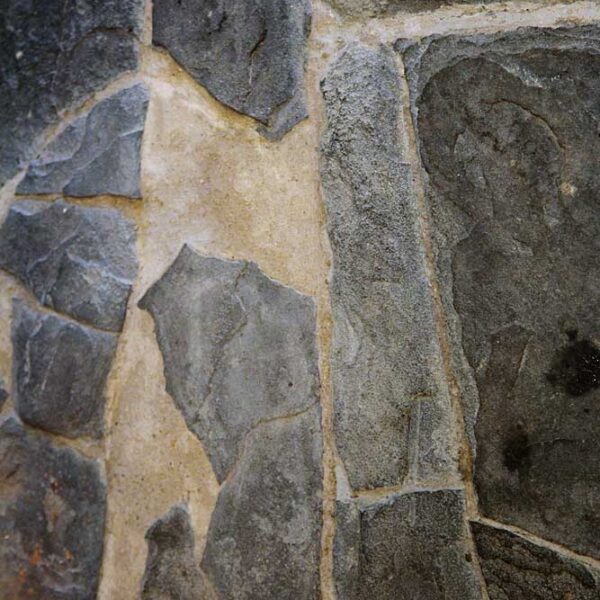 Damaged stone floor repaired with lime mortar.