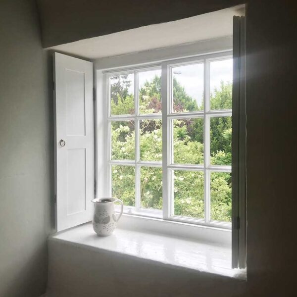 Restored window and home-made shutters.