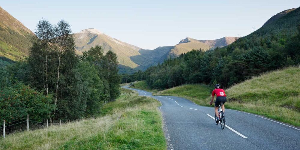 Lone cyclist on the road to Glen Nevis